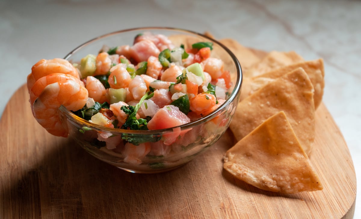 Ceviche Bowl with Shrimp and Chips on Wooden Board